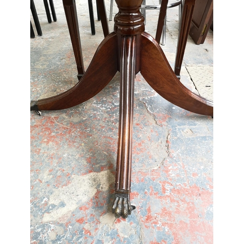 242 - A Georgian style mahogany circular pedestal dining table with four matching chairs - 76cm high x 91c... 