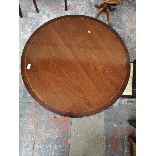 242 - A Georgian style mahogany circular pedestal dining table with four matching chairs - 76cm high x 91c... 