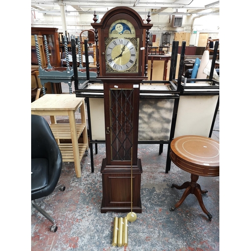 244 - A late 20th century mahogany cased grandmother clock with pendulum and three weights - approx. 165cm... 