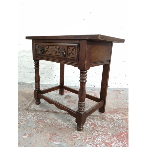 256 - A 17th century style carved oak rectangular joint side table