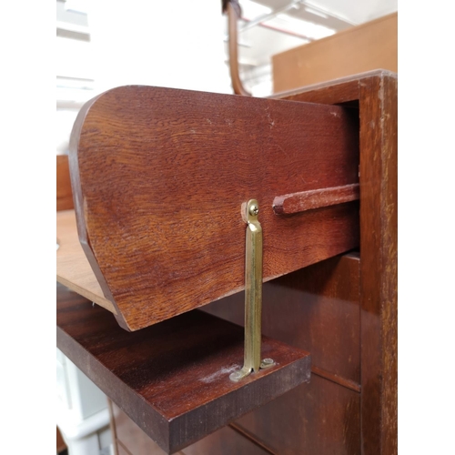 259 - A mid 20th century tola wood eight drawer music cabinet