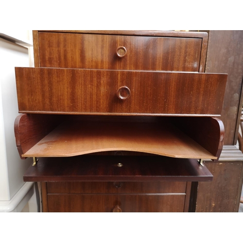 259 - A mid 20th century tola wood eight drawer music cabinet