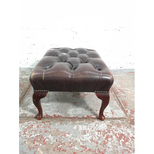 262 - A brown leather Chesterfield footstool with cabriole supports