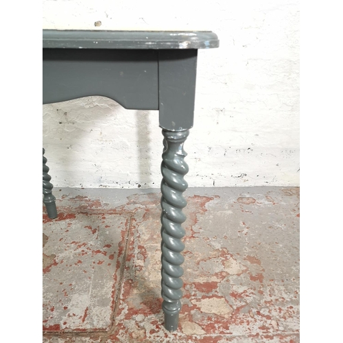 267 - An oak and grey painted square dining table on barley twist supports - approx. 77cm high x 68cm²