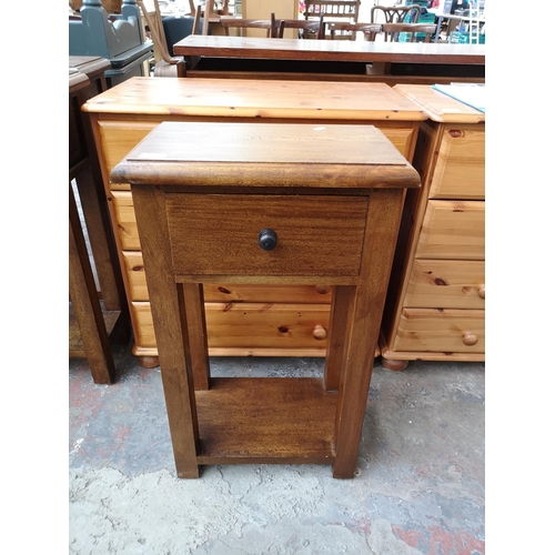 277 - A mango wood single drawer two tier side table