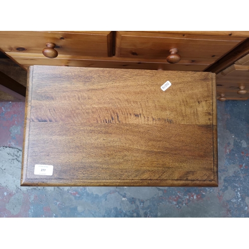 277 - A mango wood single drawer two tier side table