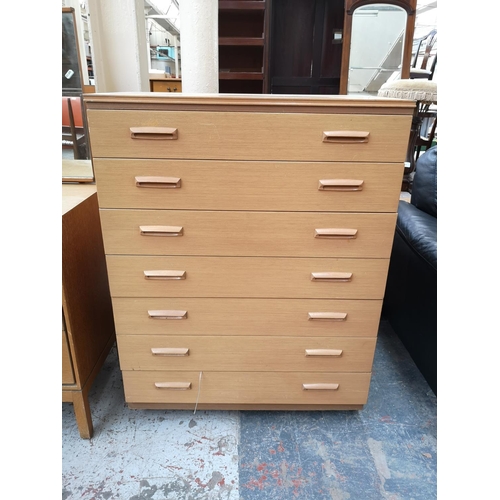 284 - A mid 20th century painted teak chest of seven drawers