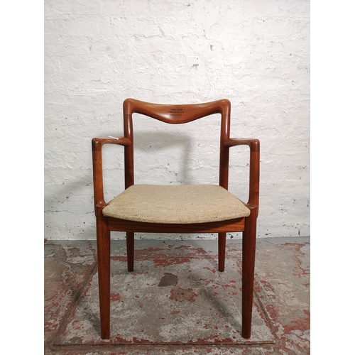 291 - A mid 20th century teak elbow chair