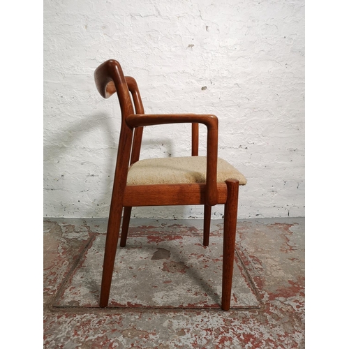 291 - A mid 20th century teak elbow chair