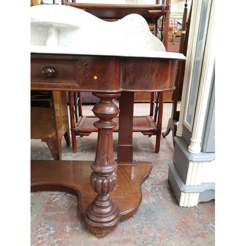 296 - A Victorian mahogany and marble top wash stand