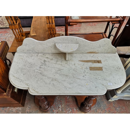 296 - A Victorian mahogany and marble top wash stand