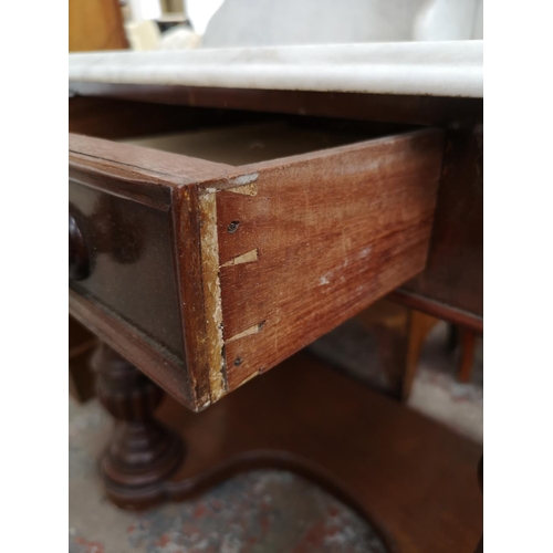 296 - A Victorian mahogany and marble top wash stand