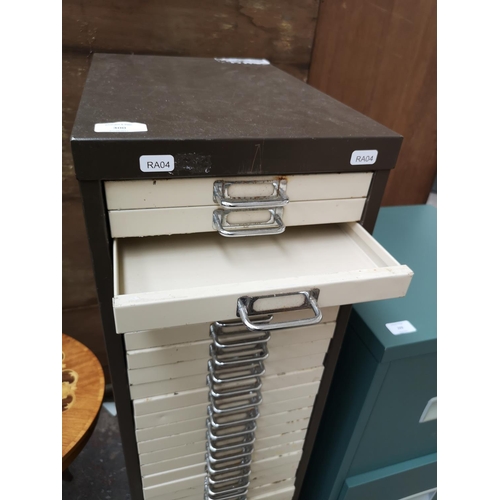 300 - A brown and cream metal thirty drawer office filing cabinet