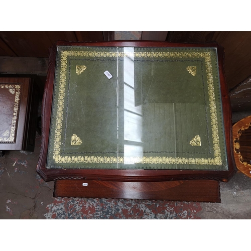 301 - Three pieces of furniture, mahogany nest of three tables with green leather inserts, mahogany rectan... 