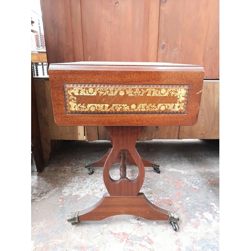 302 - A Regency style mahogany drop leaf lyre end side table with brown leather insert