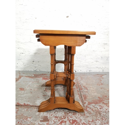 303 - A Bevan Funnell Reprodux yew wood nest of three tables