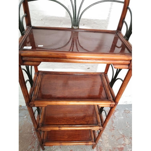 305 - A bamboo four tier free standing shelving unit