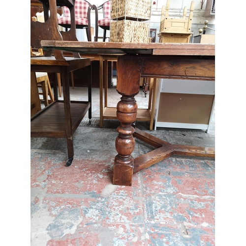 313 - A Bevan Funnell Reprodux solid oak refectory dining table with baluster supports - approx. 78cm high... 