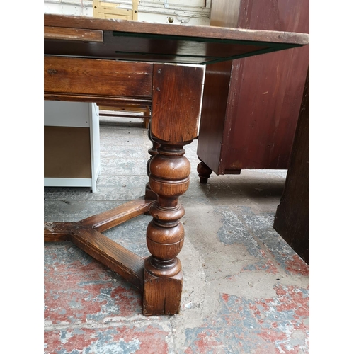 313 - A Bevan Funnell Reprodux solid oak refectory dining table with baluster supports - approx. 78cm high... 