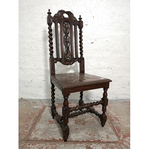 314 - A pair of 19th century heavily carved oak dining chairs with barley twist design