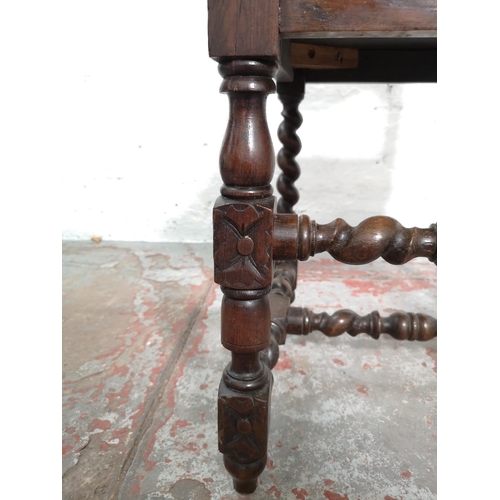 314 - A pair of 19th century heavily carved oak dining chairs with barley twist design