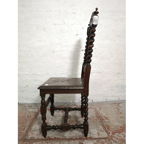 314 - A pair of 19th century heavily carved oak dining chairs with barley twist design