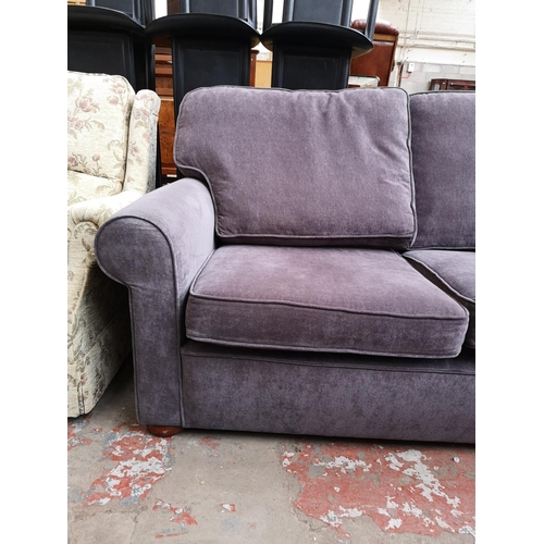 318 - A modern purple upholstered two seater sofa