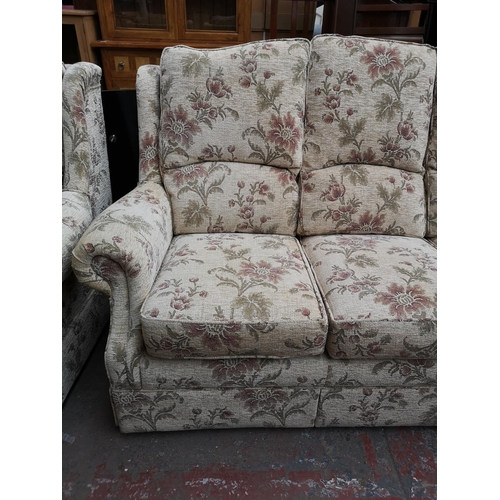 319 - An Alstons Rutland floral upholstered two piece lounge suite comprising three seater sofa and armcha... 