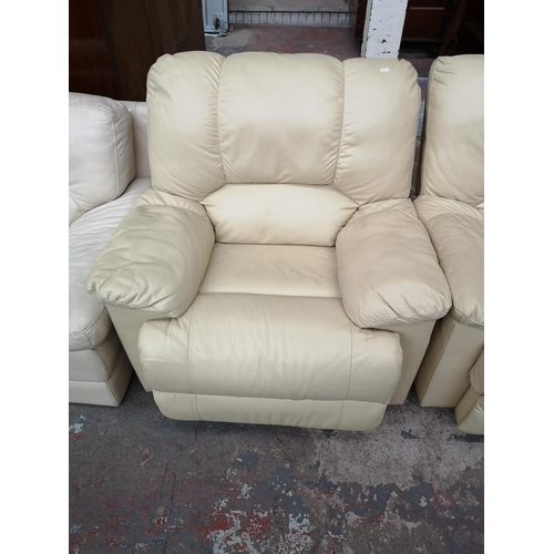 322 - Three items, two cream leather reclining armchairs and one cream leather two seater sofa