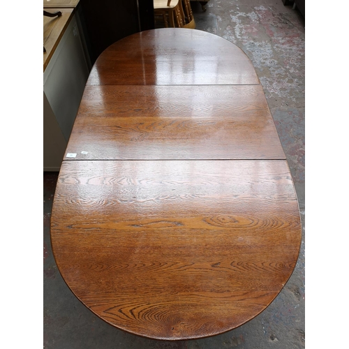 370A - An oak drop leaf gate leg dining table