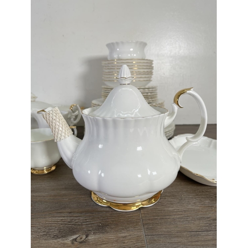 48 - A collection of Royal Albert Val D'or china to include nine cups, teapot, tureen etc.