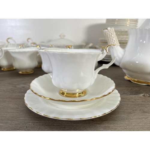 48 - A collection of Royal Albert Val D'or china to include nine cups, teapot, tureen etc.