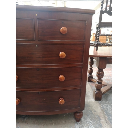 328 - A Victorian mahogany bow fronted chest of two short over three long drawers