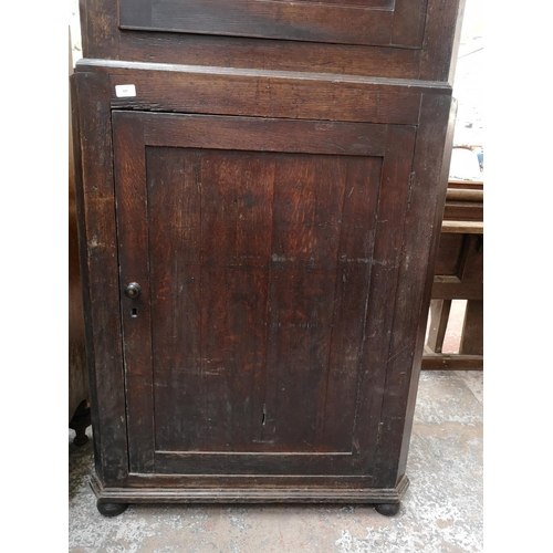 329 - A George III oak freestanding corner cabinet