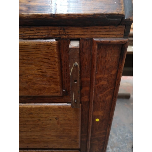 330 - A George III oak bureau bookcase - approx. 220cm high x 122cm wide x 52cm deep