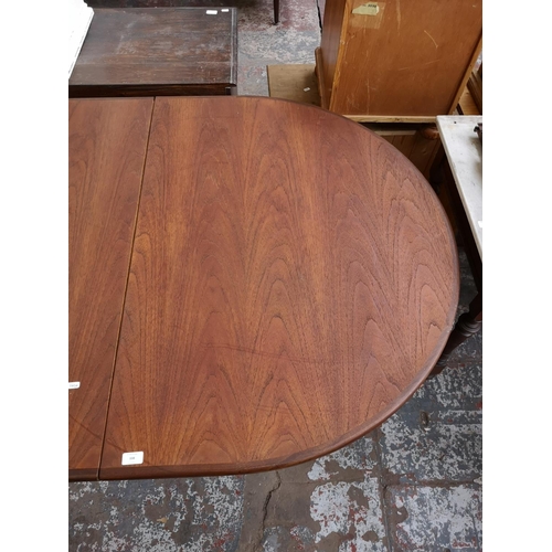 338 - A G Plan teak oval extending dining table - approx. 74cm high x 162cm long not extended x 112cm wide