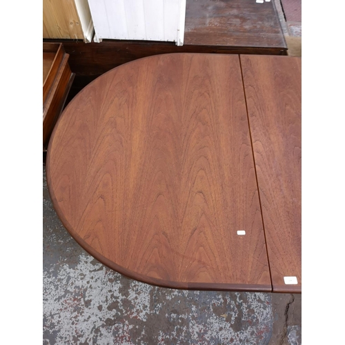 338 - A G Plan teak oval extending dining table - approx. 74cm high x 162cm long not extended x 112cm wide