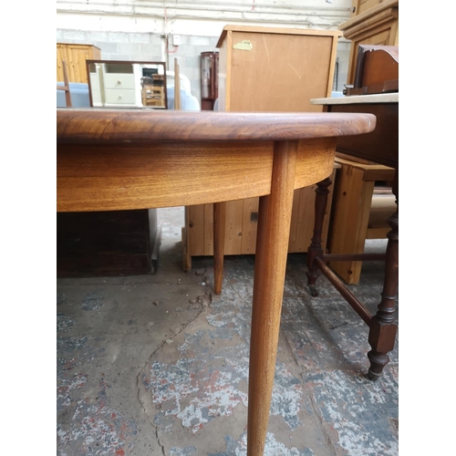 338 - A G Plan teak oval extending dining table - approx. 74cm high x 162cm long not extended x 112cm wide