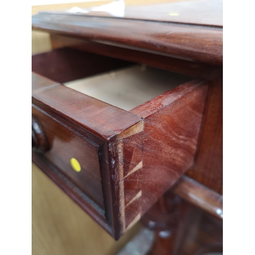 339 - A Victorian mahogany hall table with carved lion paw supports and two drawers