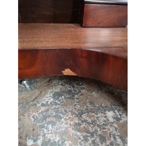 339 - A Victorian mahogany hall table with carved lion paw supports and two drawers