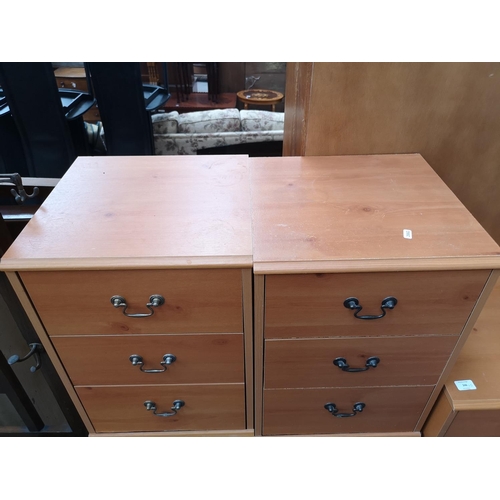 346 - Five pieces of furniture, one pine effect chest of five drawers, three matching bedside cabinets and... 