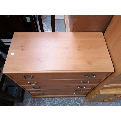 346 - Five pieces of furniture, one pine effect chest of five drawers, three matching bedside cabinets and... 