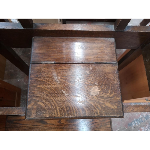 347 - Two pieces of oak furniture, one early 20th century hall stand with central bevelled edge mirror and... 