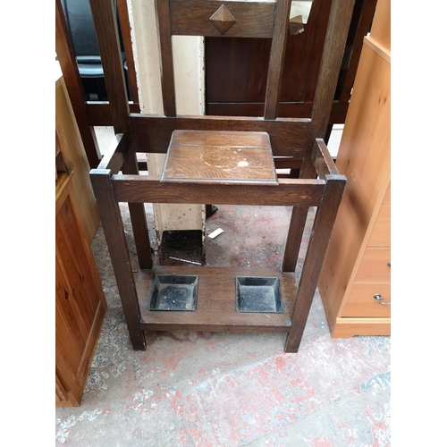 347 - Two pieces of oak furniture, one early 20th century hall stand with central bevelled edge mirror and... 