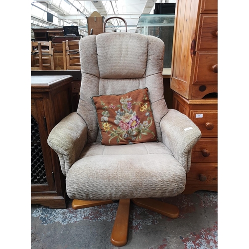 350 - A Global Furniture Alliance Ltd brown upholstered swivel reclining armchair with matching stool