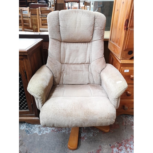 350 - A Global Furniture Alliance Ltd brown upholstered swivel reclining armchair with matching stool