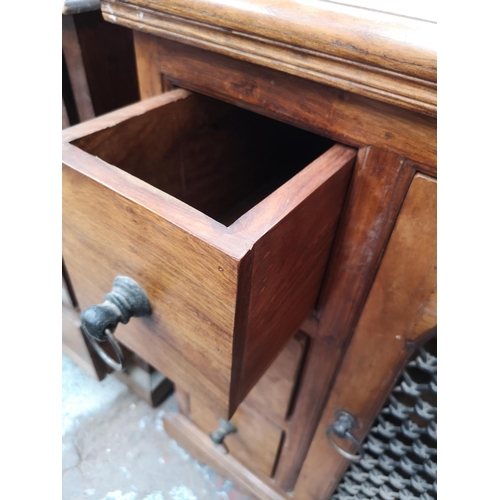 351 - An Indian sheesham wood cabinet with three drawers and single cupboard door