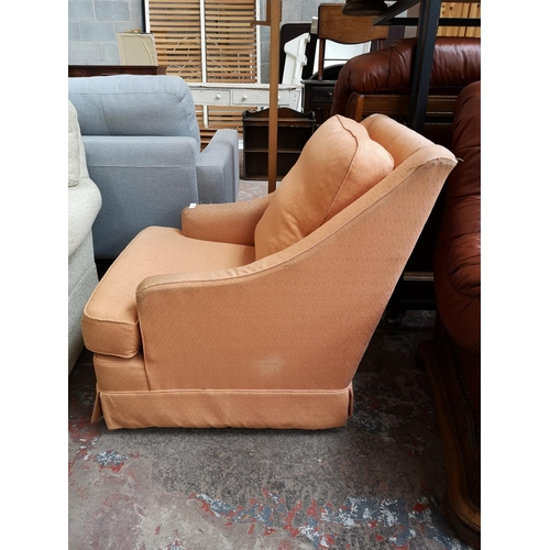 366 - A Wesley Barrell orange upholstered armchair