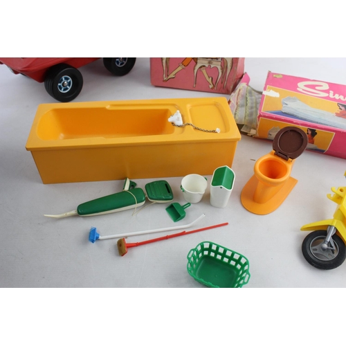 70 - A collection of vintage Sindy accessories to include buggy, moped, bath etc.