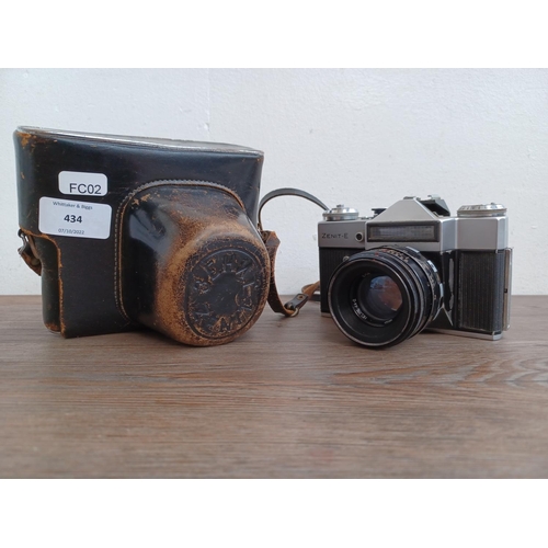 434 - A cased KMZ Zenit-E 35mm SLR camera fitted with Helios-44-2 2/58 lens